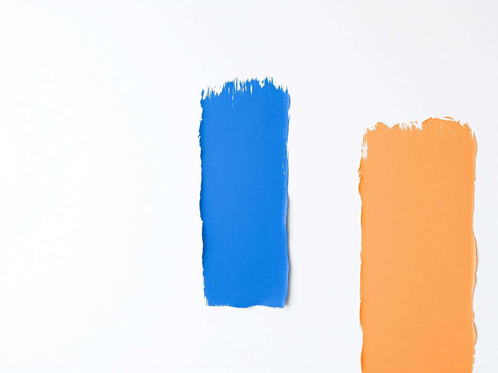 Brushed paint swatches in cobalt blue and burnt orange
